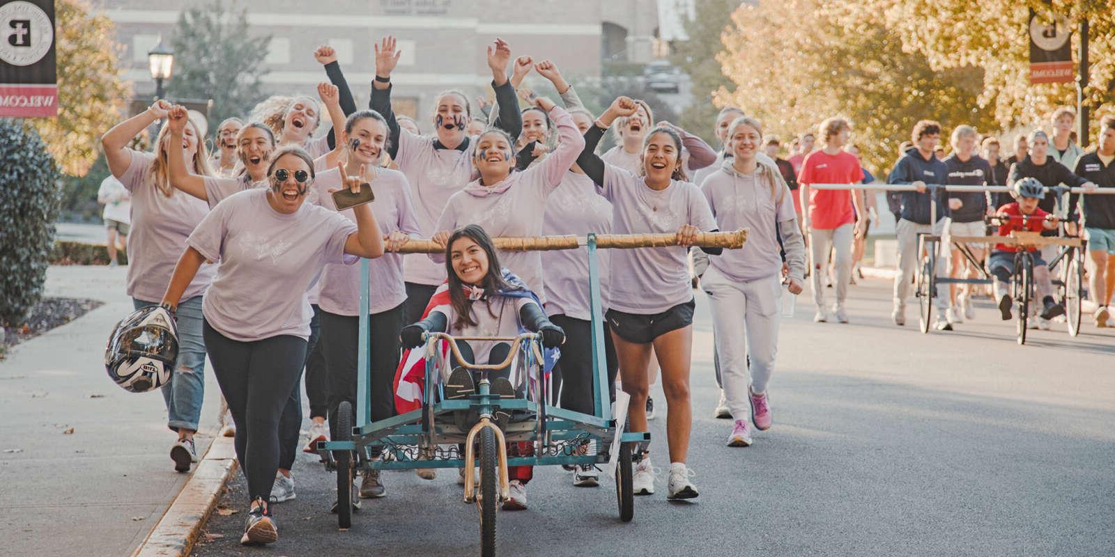 Students at the Bed Races during Homecoming Weekend